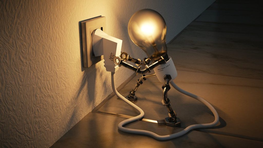 lightbulb plugging itself in